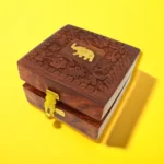 Product Feature Details Product Type Handmade Wooden Storage Box Design Elephant Design Brass Inlay Origin India Craftsmanship Nakkashi - Traditional Indian Technique Material Fabric, Metal, Wood Dimensions Length: 4", Width: 4", Height: 2" Use Jewelry or Keepsake Storage